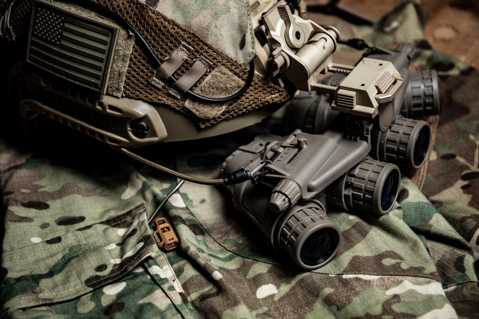 Special Forces FAST helmet with US flag equipped with panorama night vision goggles on a multicam pattern uniform.